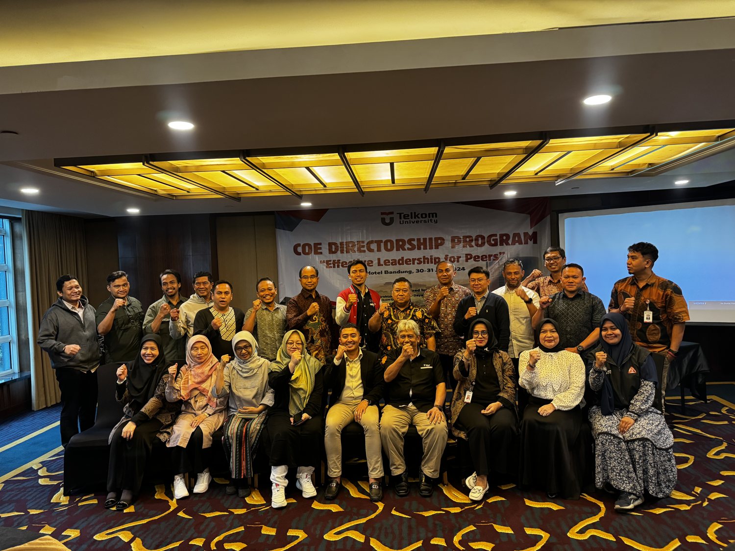 Business conference with diverse audience and speaker presenting market data.